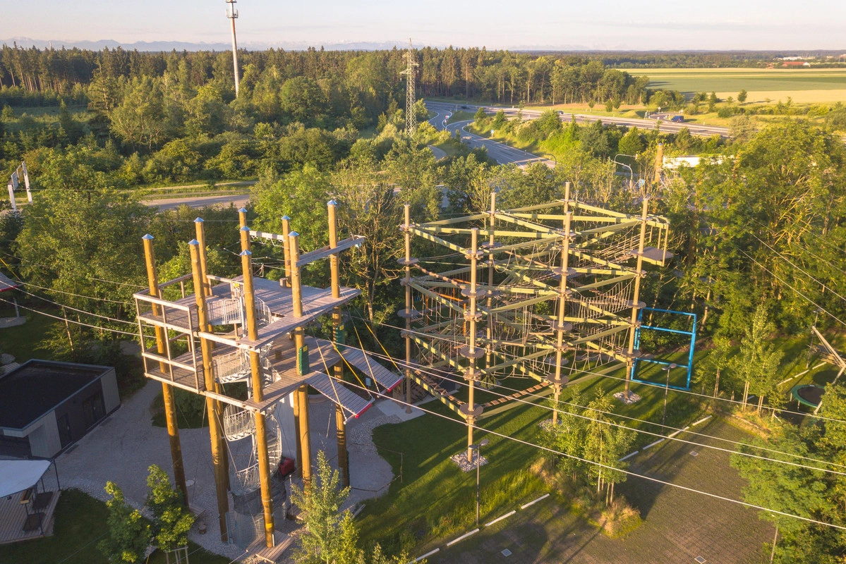 The Jochen Schweizer Outdoor Park photographed from above. Large climbing facility, surrounded by many trees