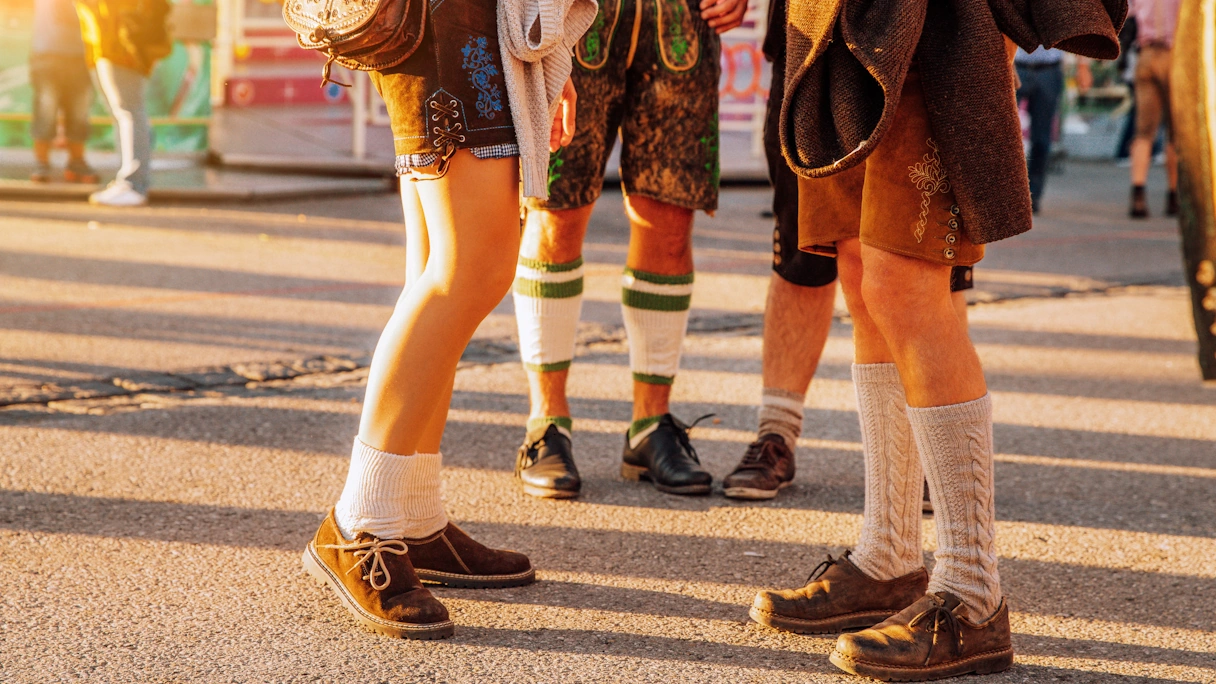 Oktoberfest visitors dressed in lederhosen