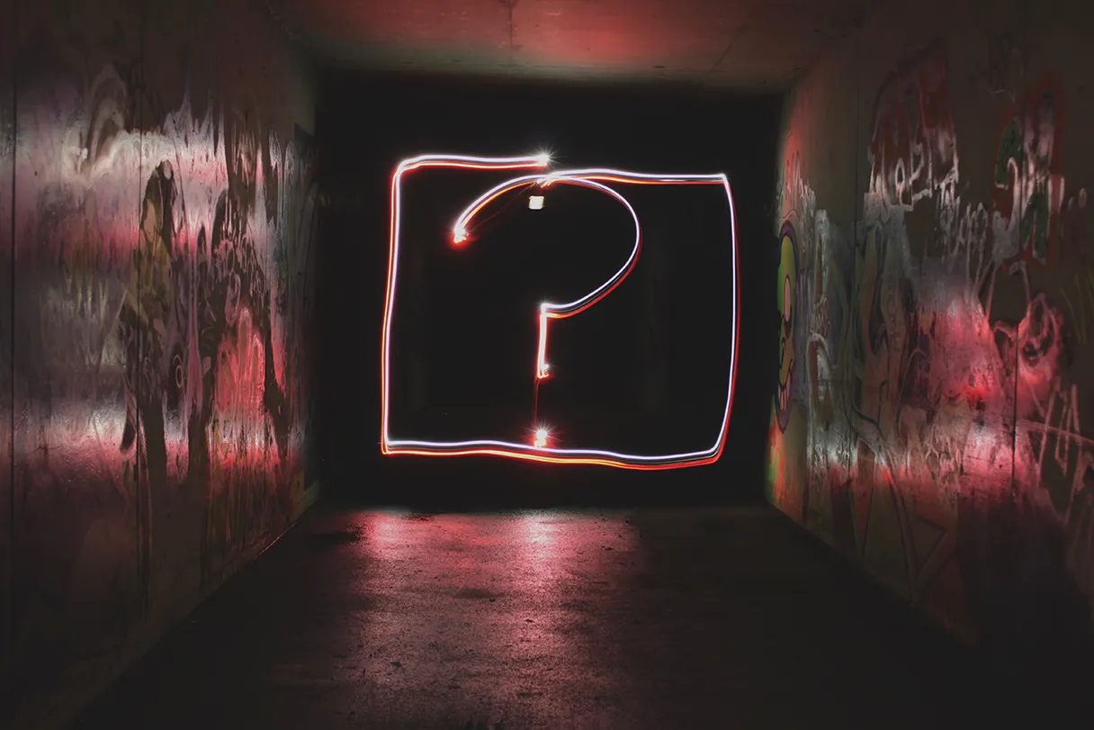 FAQ, red question mark was written with light painting in a dark room