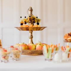 Schlosscafé im Palmenhaus Castle café in the Palm House, on a table are various etagères with fruit, other filled glasses are scattered on the table