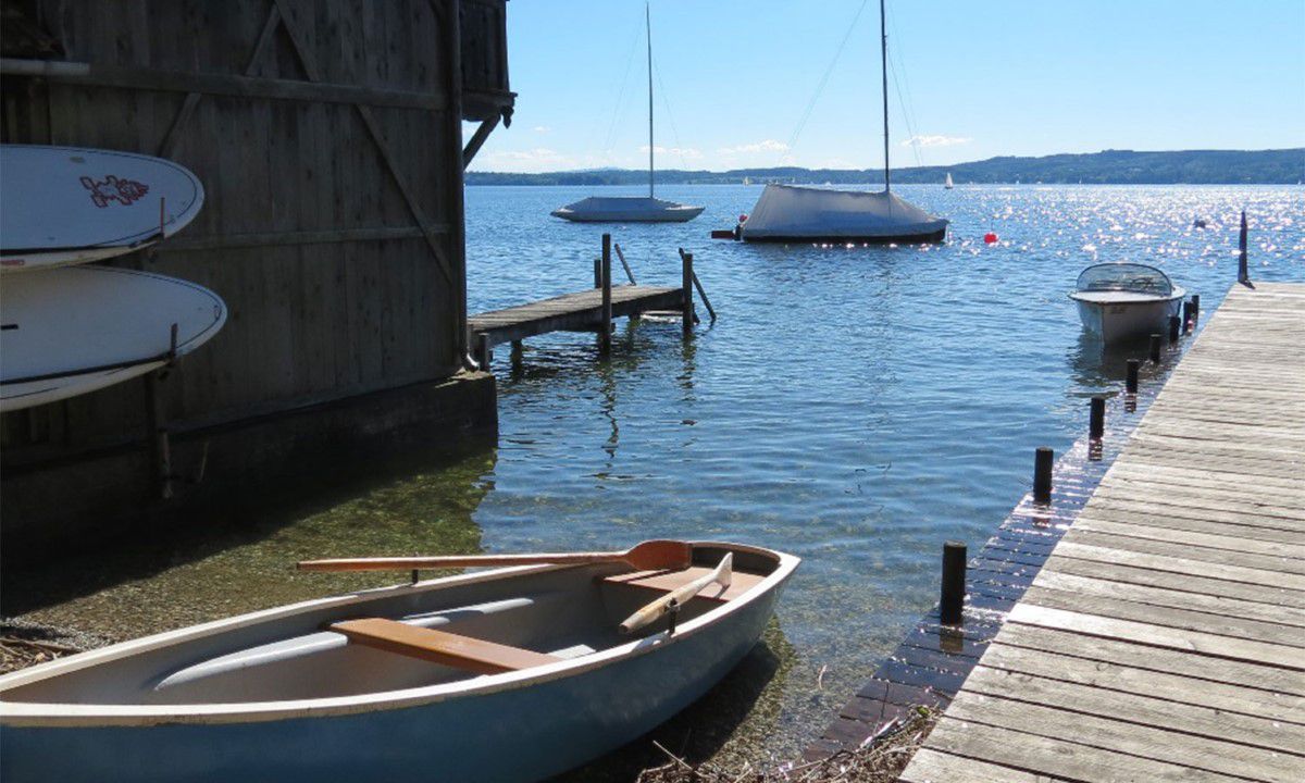 Rowing boat with view of the Ammersee lake