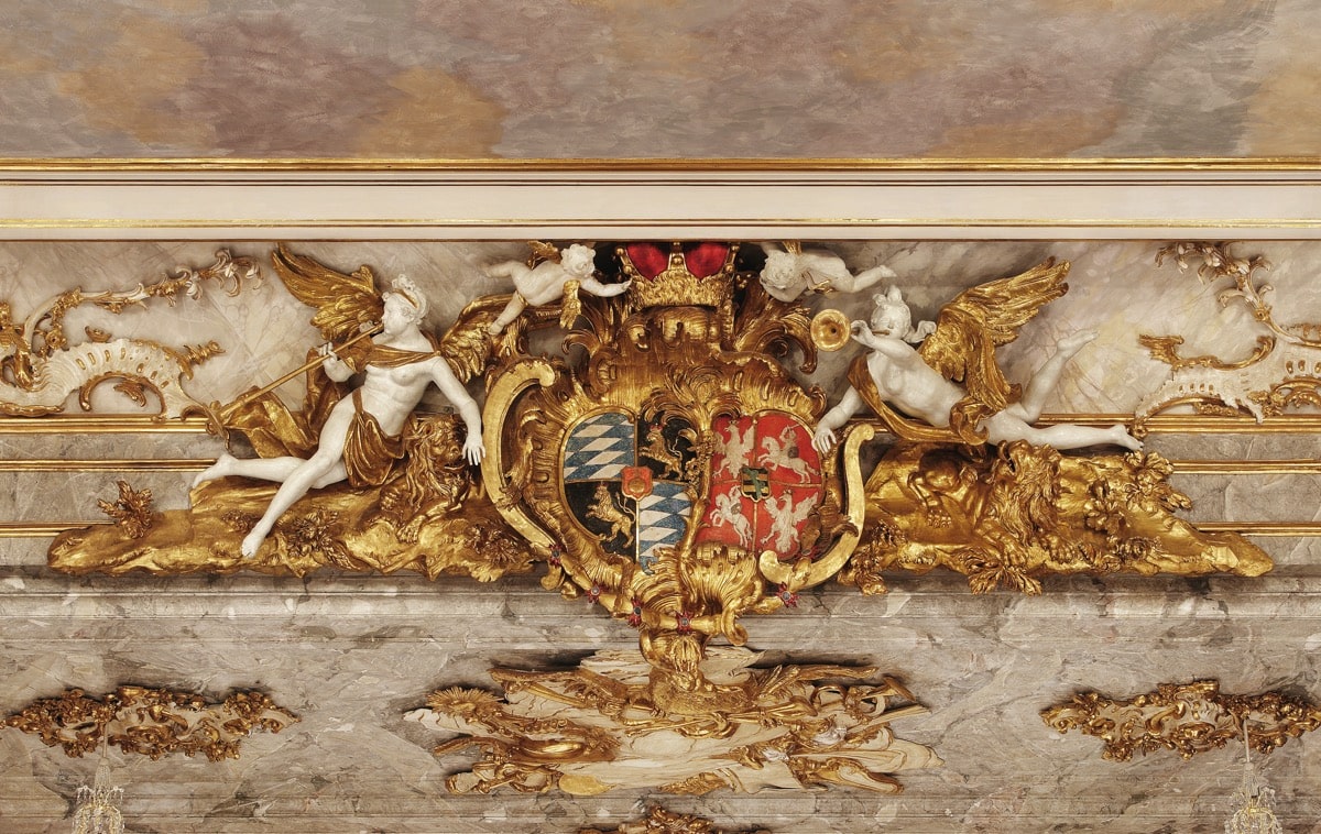 Cuvillies theater ceiling and wall decoration of gold with angels and a coat of arms
