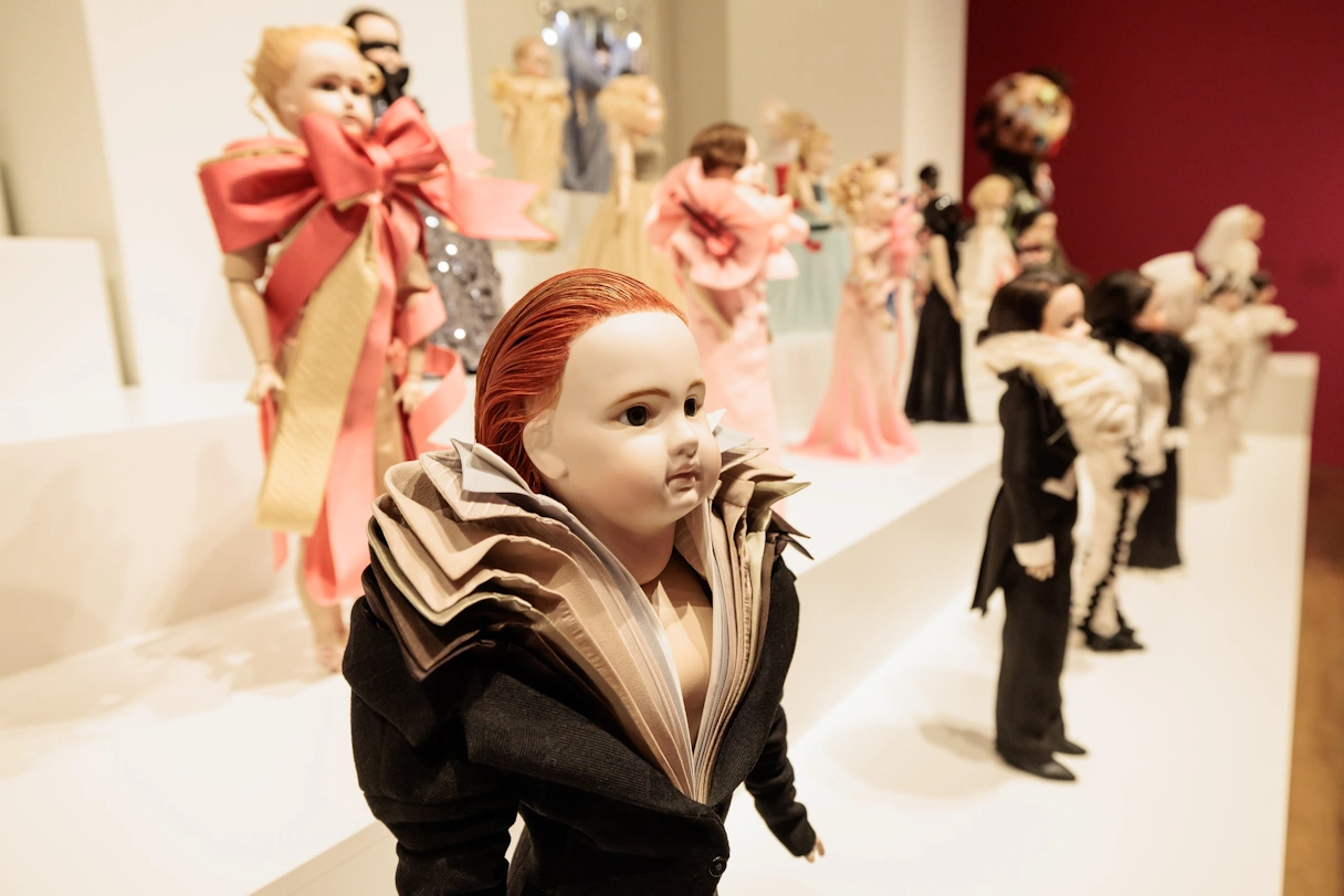 Small dolls in different colorful suits and dresses with lots of details