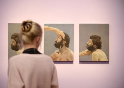3 paintings at the Kunsthalle München. The exhibition is titled HAIR – POWER – DESIRE, and each painting depicts a man with thick, dark hair and a thick beard. In all the paintings, he tilts his head to one side, and in the middle painting, someone is holding a pair of scissors to his beard.