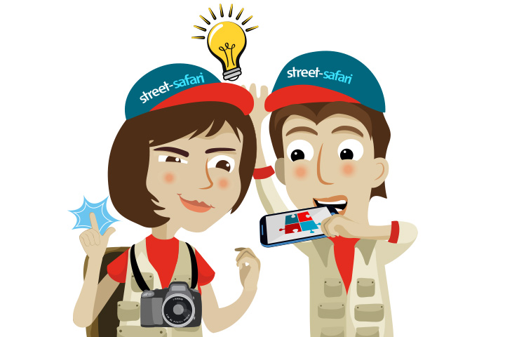 Zwei animierte Personen lösen ein Street Safari Rätsel und freuen sich