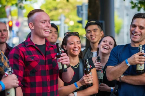 The Beer Tour by The Local Experience. The group is hanging out together, drinking beer, and laughing