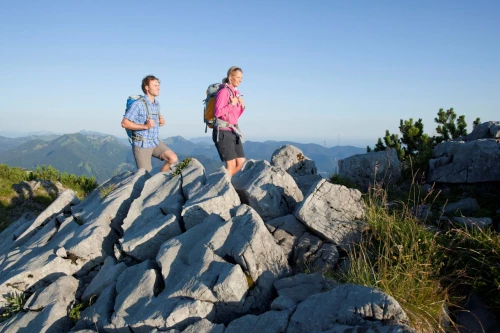 Two hikers on the summit of the Wallberg